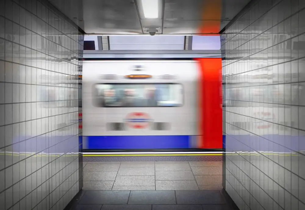 tube-train-speeding-past-at-station