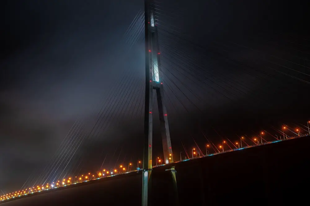 bridge to russky island lit up at night